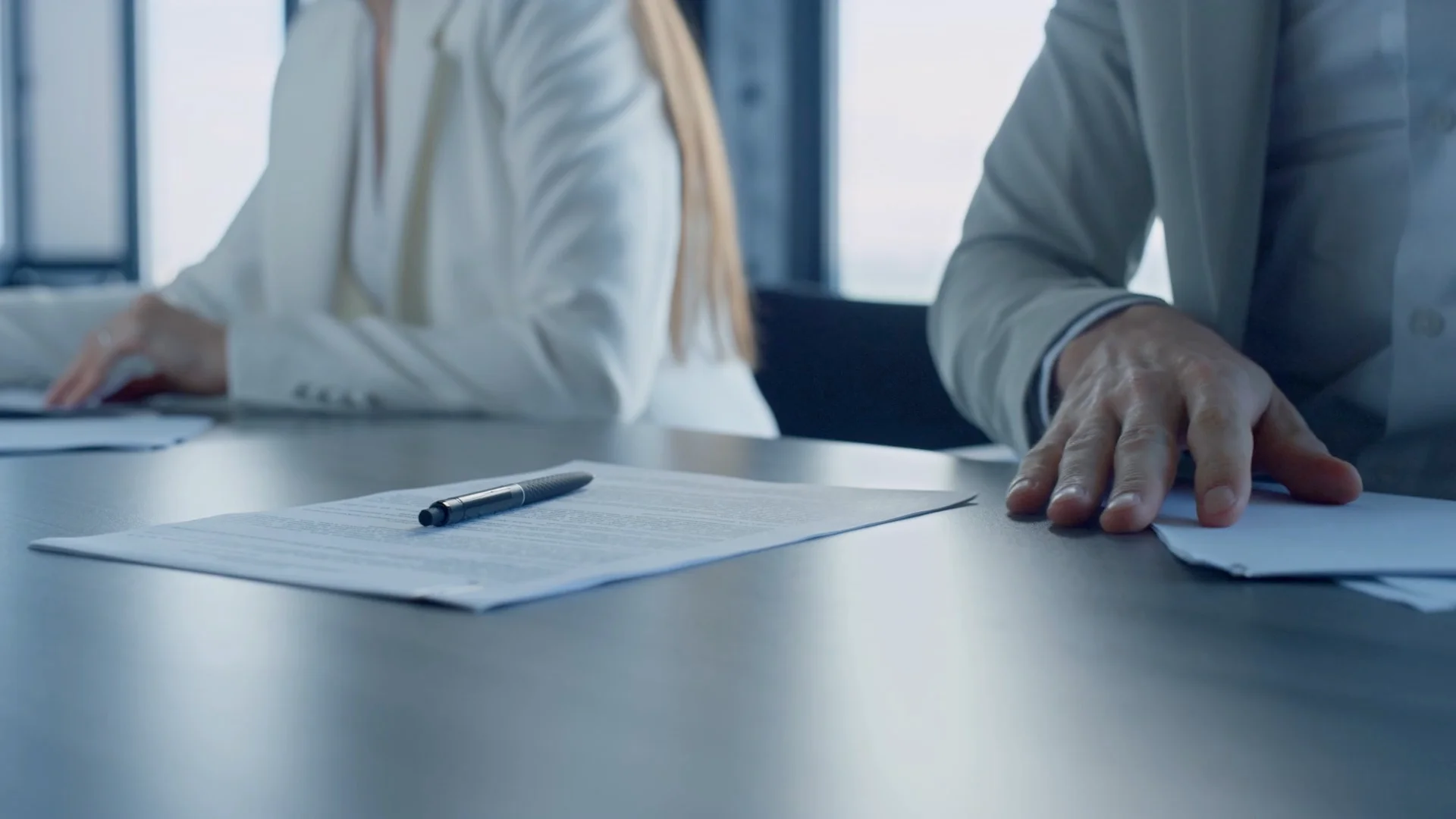 Corporate conference room, defense procurement team, and contract document review
